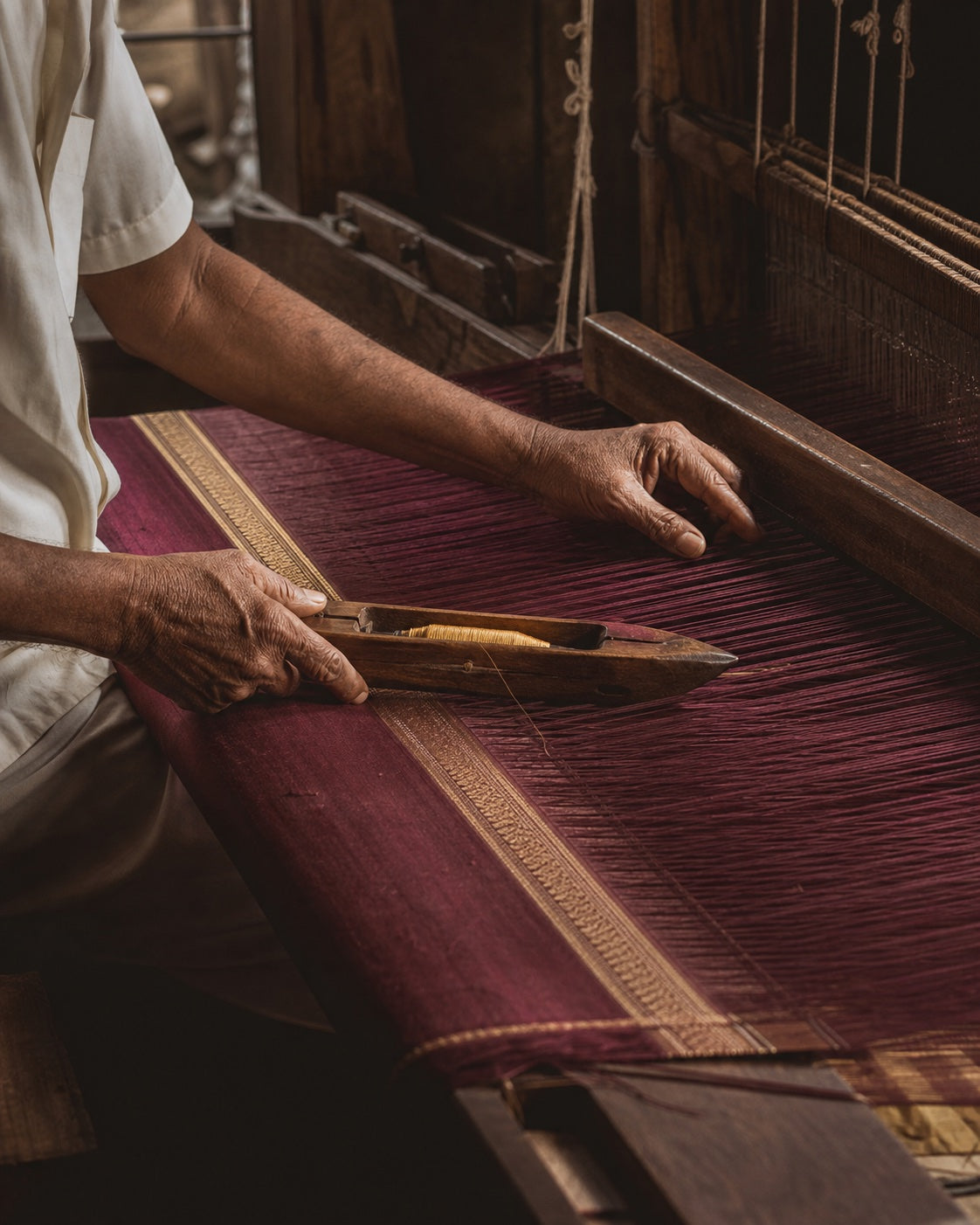 Artisan working at a traditional handloom